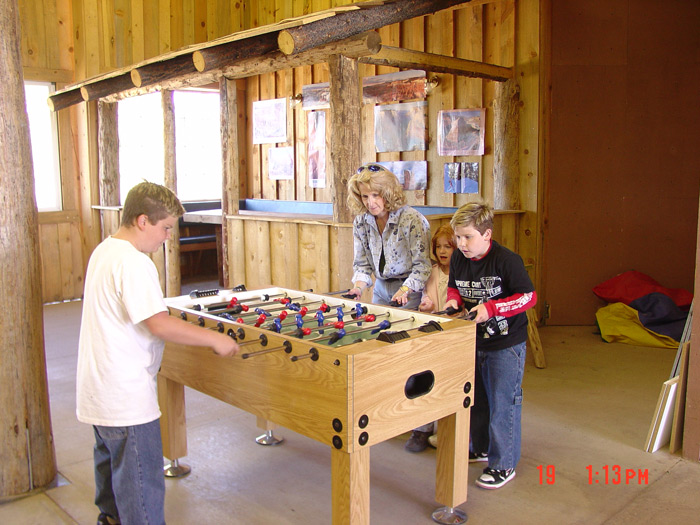 Mom-Mike-Chris-Angel playing fuseball at Zion Pondersosa. ~2005