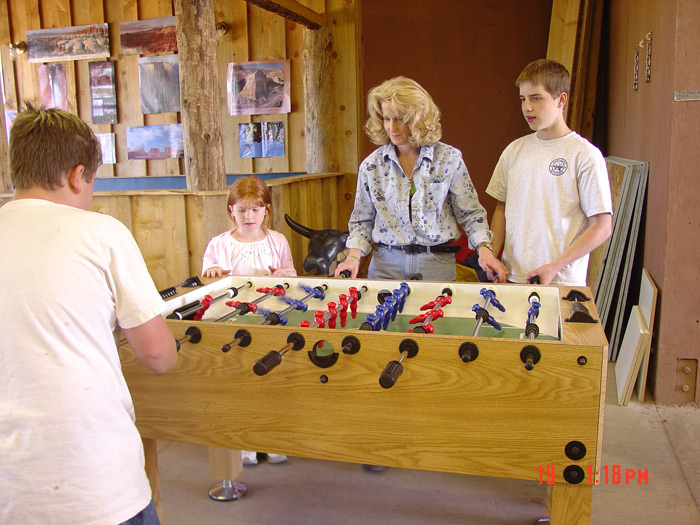 Mom-Mike-Nick-Angel playing fuseball at Zion Pondersosa. ~2005
