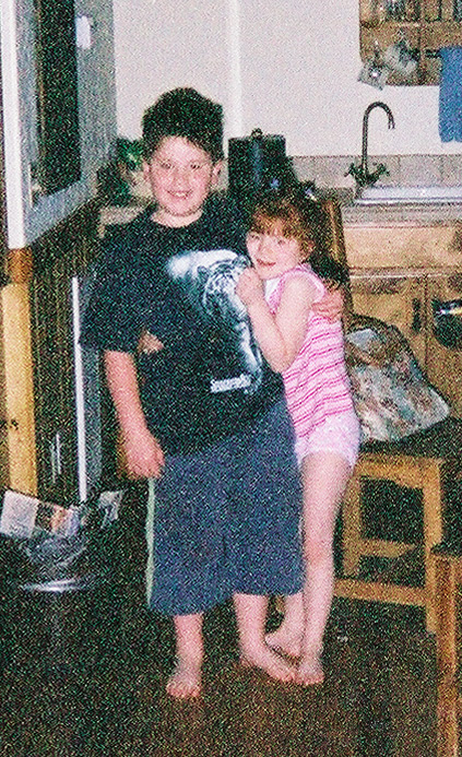 Protecting his baby sister in the Sorrel River Ranch cabin. ~2003
