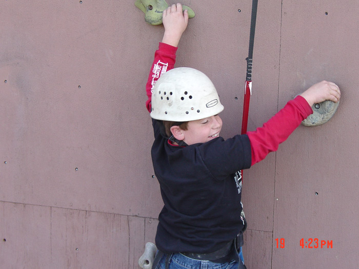 Attempting the Rock wall.. ~2006