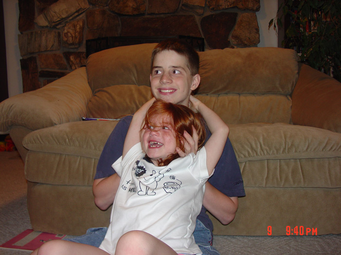 Rough-housing with Chris as they both pose for the camera.
~2005