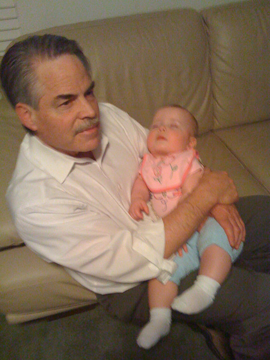 Dad holding baby Natayah 2008