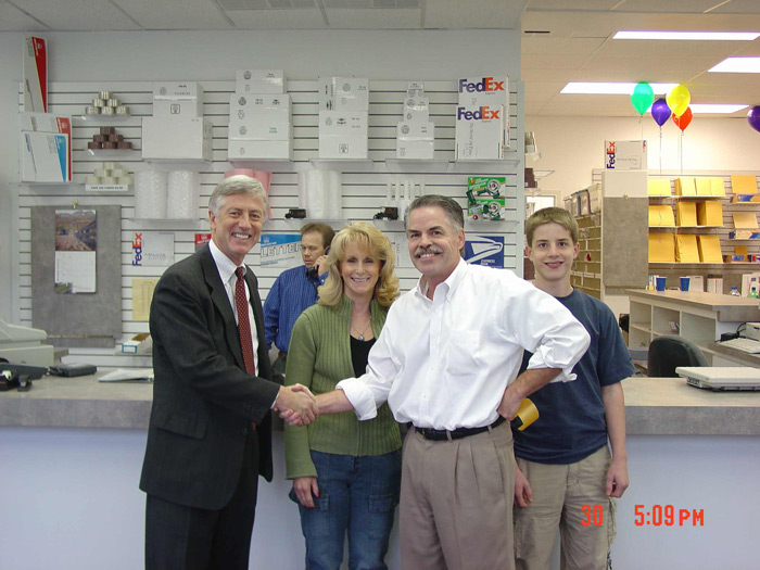 Dad & Major Rocky Anderson shaking hands for the Grand opening of the new store. 2003