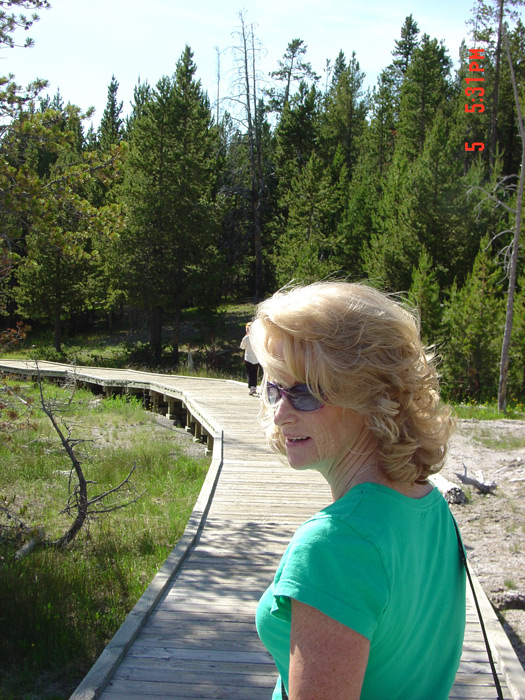 Mom walking along the Old Faithfull Inn Boardwalk ~2005